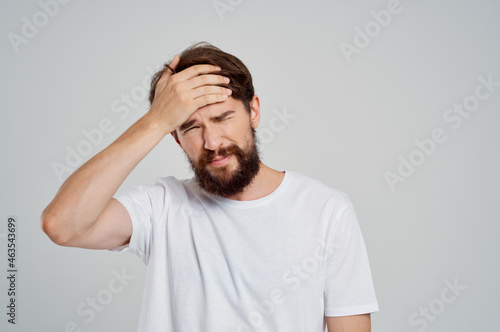 man holding his head pain stress emotions Studio treatment
