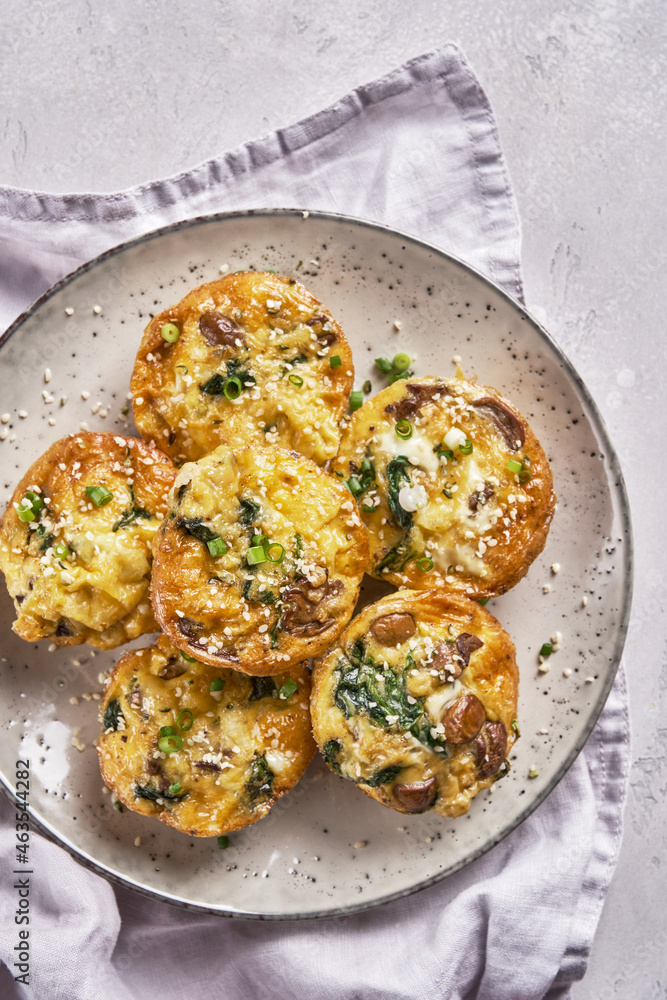 Fototapeta premium Vegetarian egg muffins with mushroom, spinach and cheese for Breakfast