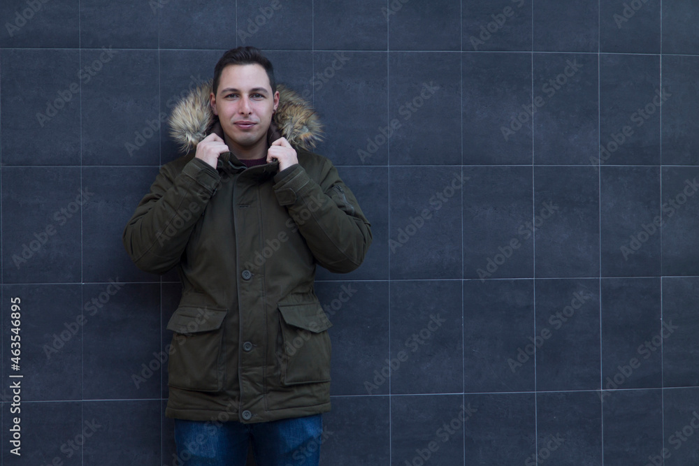 young man in jacket or coat on wall young man in jacket or coat on wall