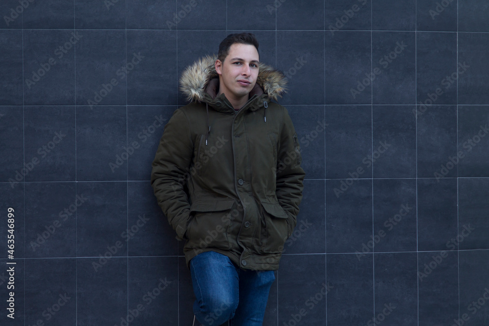 young man in jacket or coat on wall young man in jacket or coat on wall