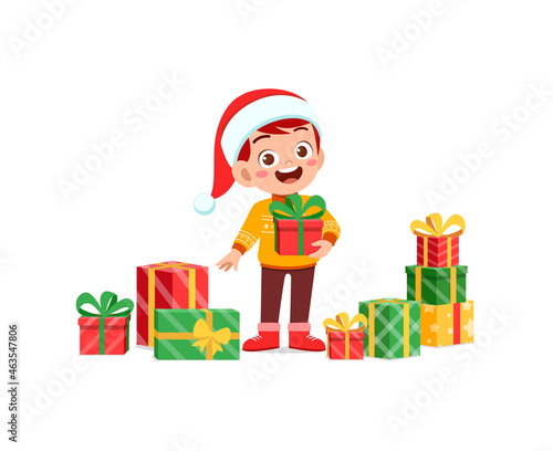 happy little boy holding present for christmas