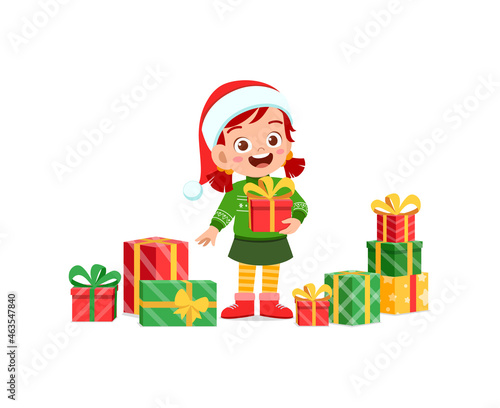 happy little girl holding present for christmas