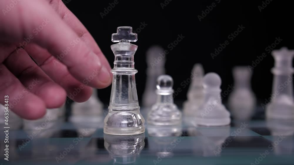 hand dropping chess king resign lost game slow motion hand dropping chess king resign lost game slow motion