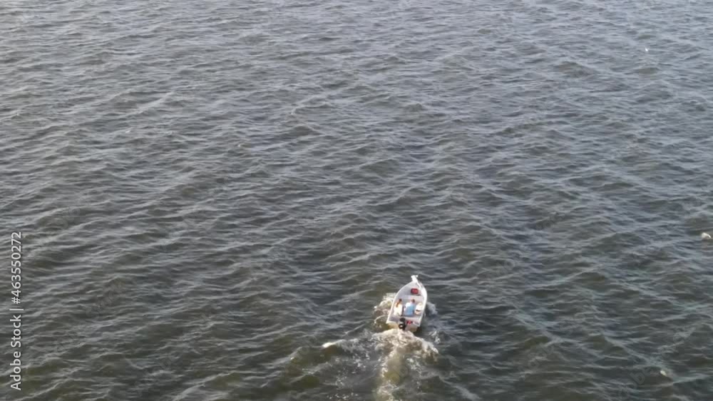 Motor Boat Sailing On Wavy Ocean During Windy Summer Day. Aerial Drone Motor Boat Sailing On Wavy Ocean During Windy Summer Day. Aerial Drone