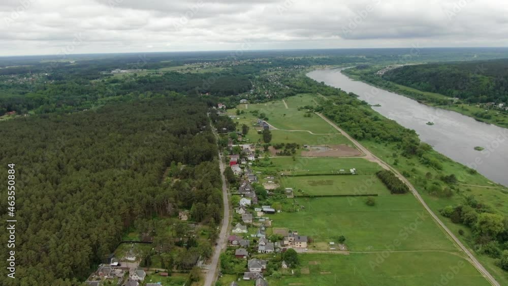 Majestic Lithuania landscape on cloudy day with river and forest, flying view over small town Majestic Lithuania landscape on cloudy day with river and forest, flying view over small town