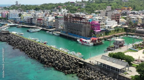 Aerial drone hovering around Baishawei fishing  harbor town at Xiaoliuqiu Lambai Island, Pingtung, Taiwan. photo