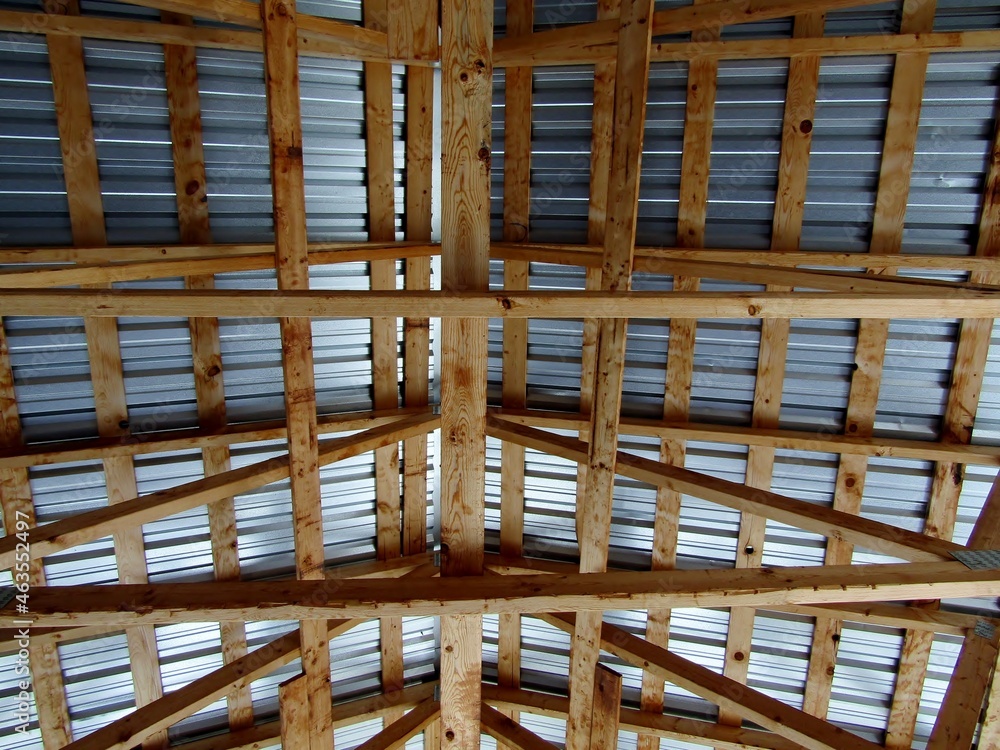 Corrugated steel and wooden beams roof of open-air pavilion. Corrugated steel and wooden beams roof of open-air pavilion.