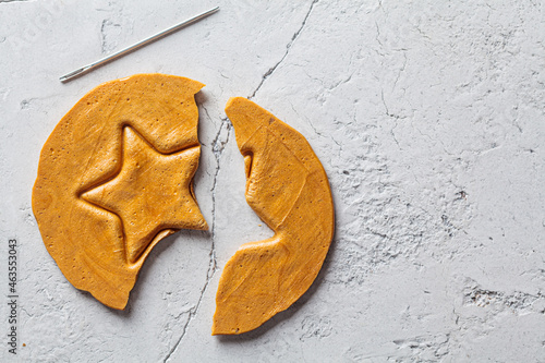 Dalgona Candy - South Korean treat. Round sugar cookie with star inside.