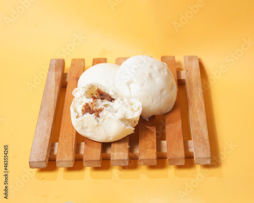Bakpao bread for a healthy breakfast menu. It is highly recommended to eat the buns that are still hot. Bakpao usually has various fillings such as nuts and chocolate. Chinese specialties. Focus blur.