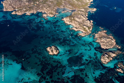View from above, stunning aerial view of La Maddalena archipelago with some islands bathed by a turquoise and clear waters. Sardinia, Italy.