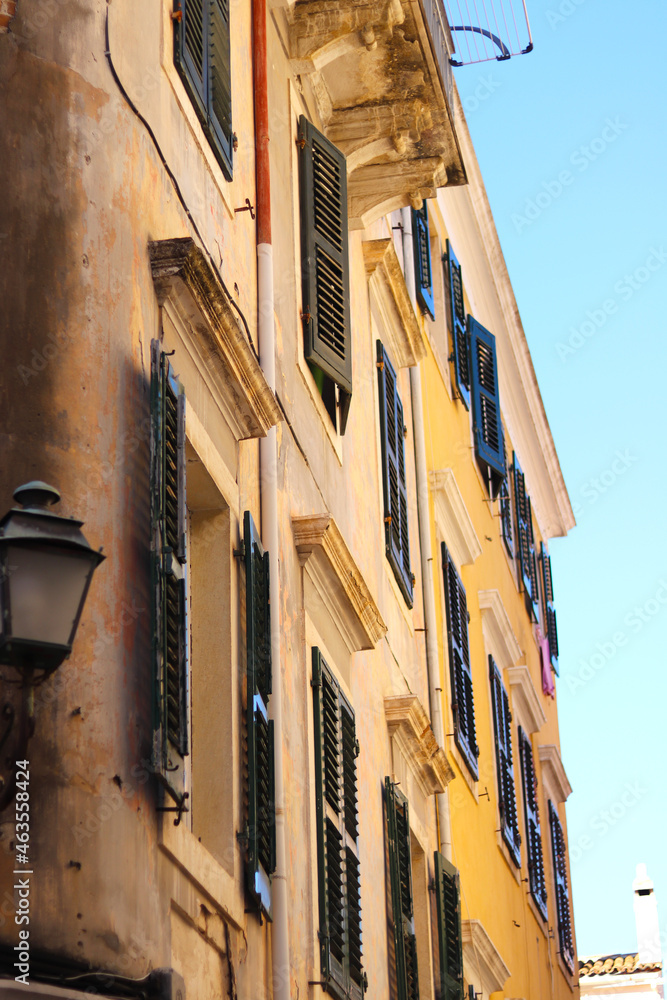 Windows and balconies in Kerkyra, Corfu. Old style traditional vintage for background. Typical Architecture of Old Town at Corfu Town.