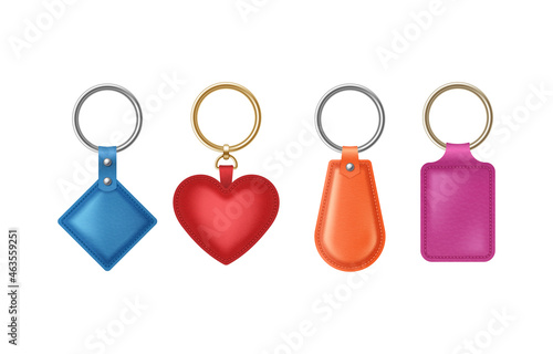 Leather keychains of different shapes, holders set with metal ring. Accessories or souvenir trinkets