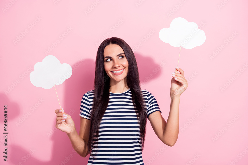 Photo portrait of pretty brunette looking at cloud thoughtful dreamy isolated on pastel pink color background Photo portrait of pretty brunette looking at cloud thoughtful dreamy isolated on pastel pink color background