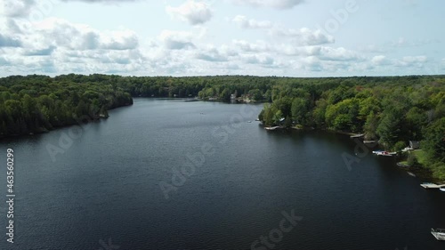 A row of cottages sit at the edge of a lake in the Muskoka region of Ontario photo