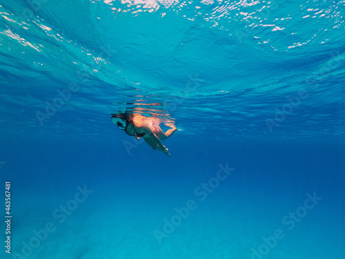 Underwater photo of beautiful woman snorkeling