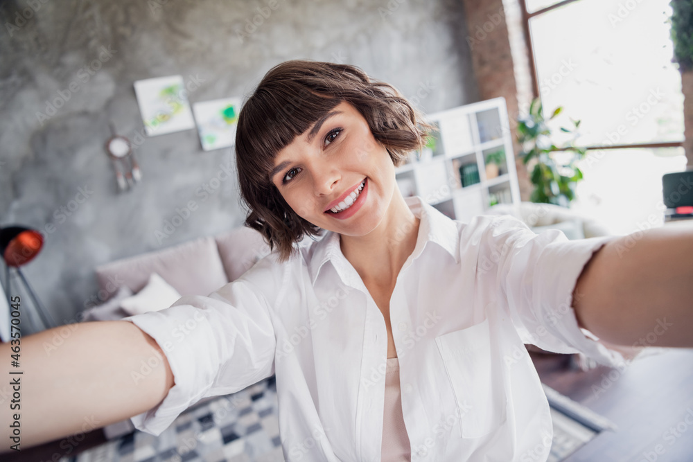 Self-portrait of attractive cheerful brown-haired girl freelancer staying safe at home loft brick interior apartment indoors Self-portrait of attractive cheerful brown-haired girl freelancer staying safe at home loft brick interior apartment indoors