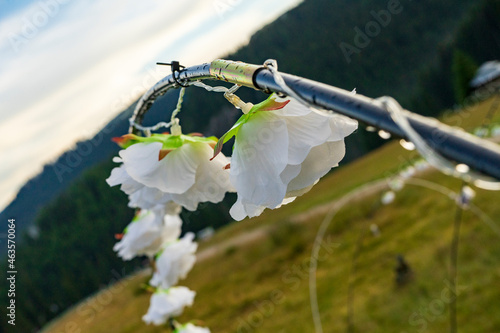 Lights decoration hanging on a wire, outside in mountains area, rainy day