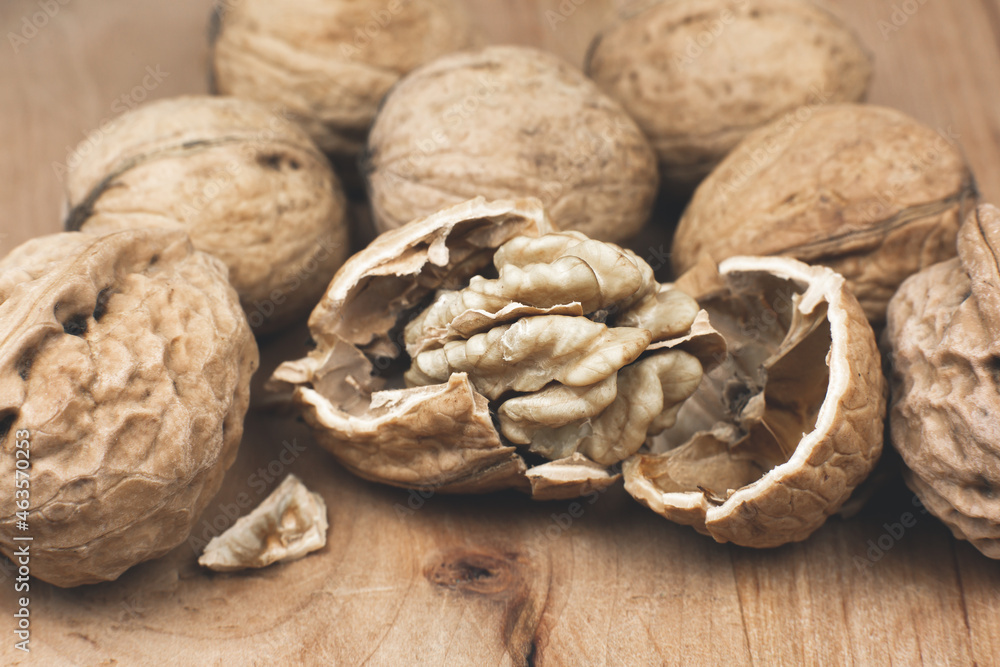 Crushed Walnut on the wood background. Close up. Crushed Walnut on the wood background. Close up.