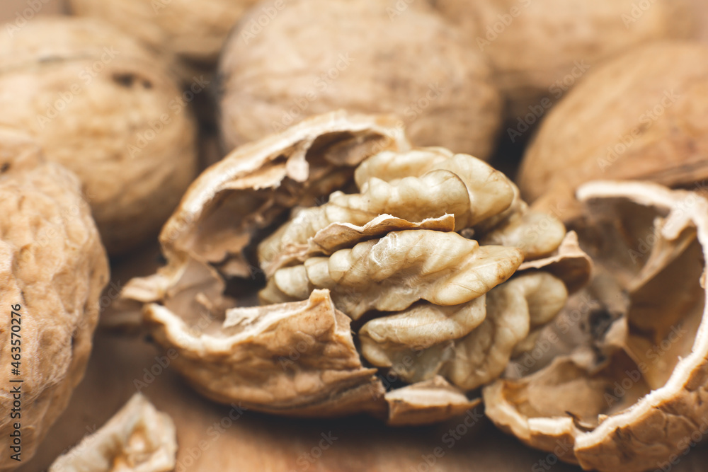 Crushed Walnut on the wood background. Close up. Crushed Walnut on the wood background. Close up.