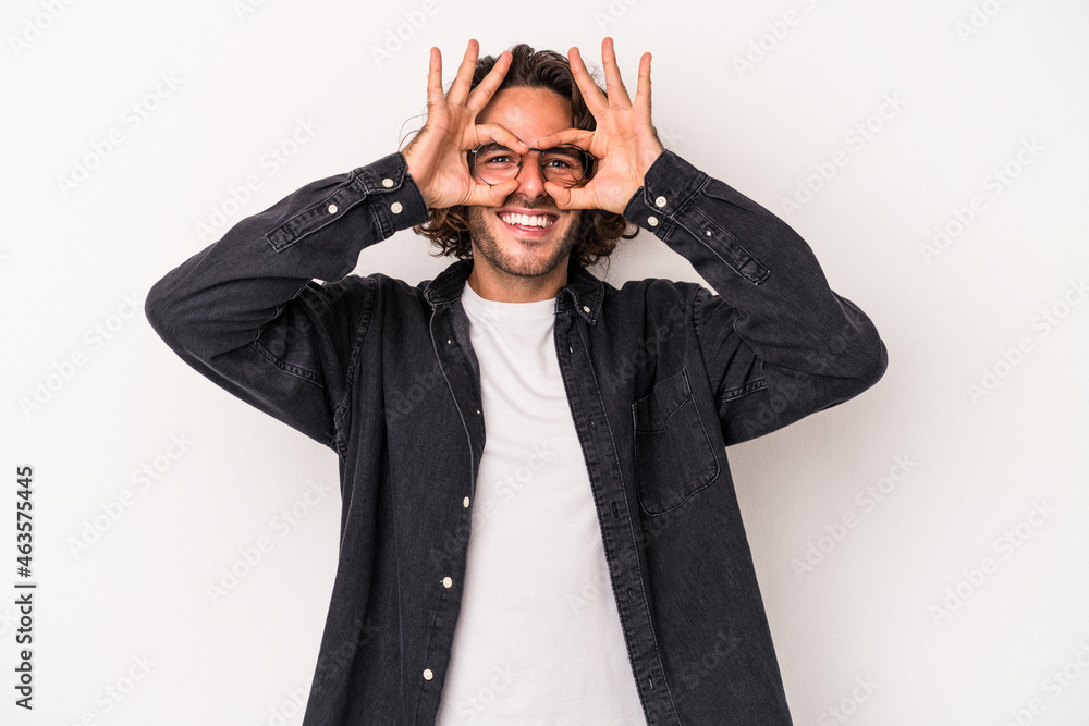 Young caucasian man isolated on white background excited keeping ok gesture on eye. Young caucasian man isolated on white background excited keeping ok gesture on eye.