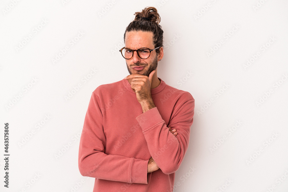 Young caucasian man isolated on white background thinking and looking up, being reflective, contemplating, having a fantasy. Young caucasian man isolated on white background thinking and looking up, being reflective, contemplating, having a fantasy.