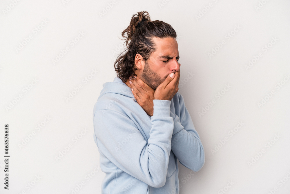 Young caucasian man isolated on gray background suffers pain in throat due a virus or infection. Young caucasian man isolated on gray background suffers pain in throat due a virus or infection.