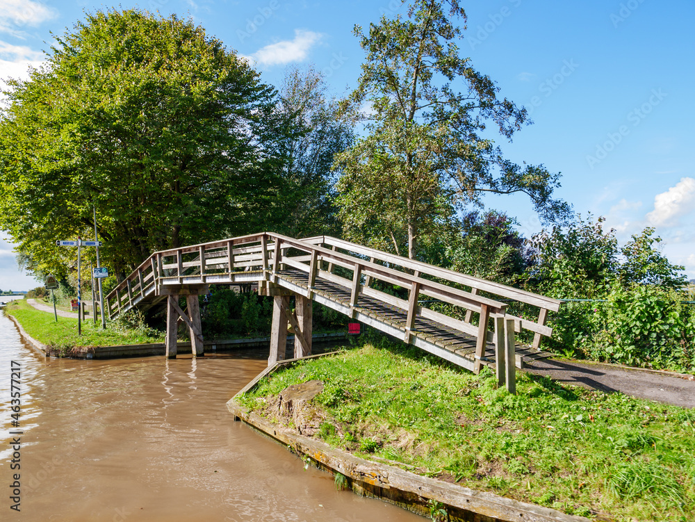 Wooden bridge for cycles and pedestrians by Dokkumer Ee in Bartlehiem, Friesland, Netherlands Wooden bridge for cycles and pedestrians by Dokkumer Ee in Bartlehiem, Friesland, Netherlands