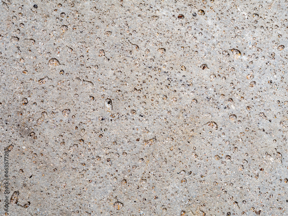 Grey decorative porous concrete tile used for paving gardens seen from above Grey decorative porous concrete tile used for paving gardens seen from above