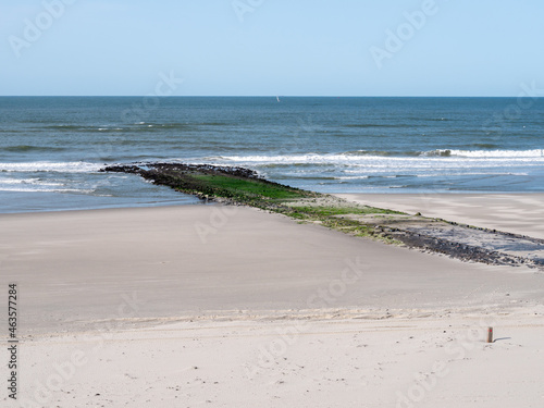 Breakwater on sandy beach of North Sea coast of West Frisian island Vlieland, Netherlands photo