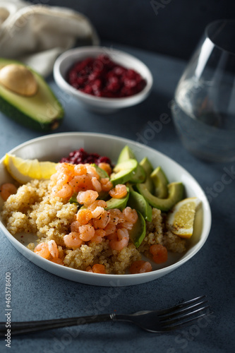 Healthy quinoa bowl with shrimps and avocado