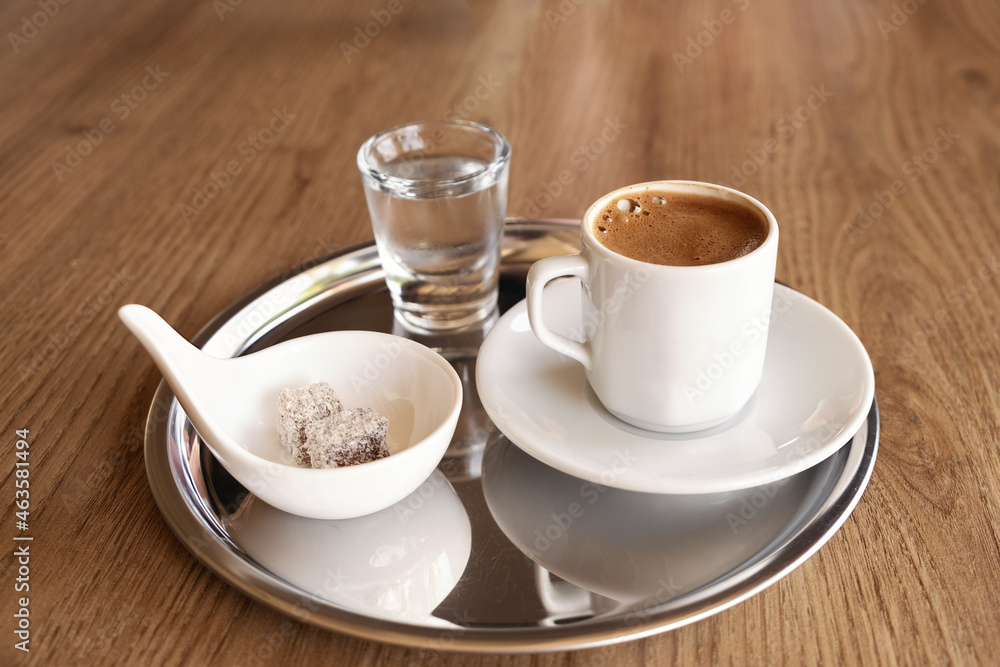Traditional Turkish coffee with cold water and Turkish delight Traditional Turkish coffee with cold water and Turkish delight