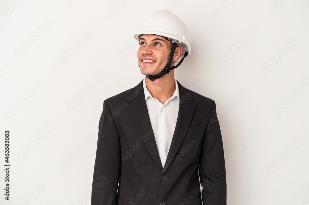 Young architect caucasian man isolated on white background dreaming of achieving goals and purposes Young architect caucasian man isolated on white background dreaming of achieving goals and purposes