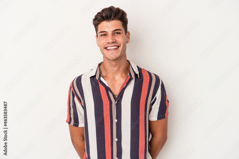 Fototapeta premium Young caucasian man isolated on white background happy, smiling and cheerful.