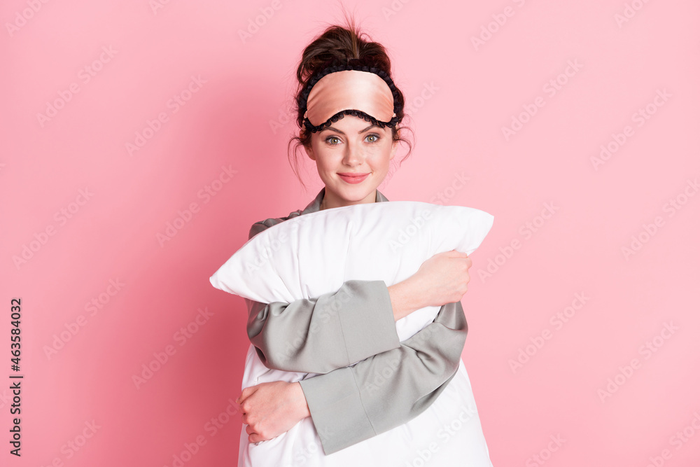 Portrait of charming lady hands hold hugging cushion smile look camera isolated on pink color background