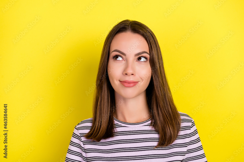 Photo of nice millennial lady look empty space wear striped t-shirt isolated on yellow color background Photo of nice millennial lady look empty space wear striped t-shirt isolated on yellow color background