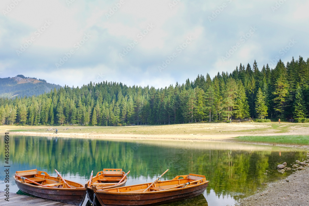 Boat on the Black Lake. National park Durmitor Mouintains in Montenegro.
