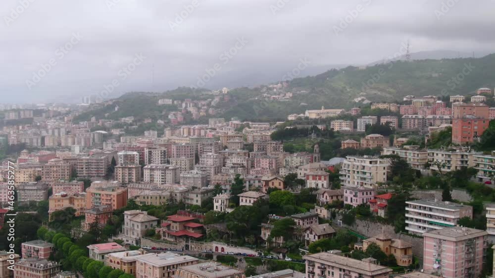 Cityscape of Genoa on cloudy and stormy day, aerial cinematic view Cityscape of Genoa on cloudy and stormy day, aerial cinematic view