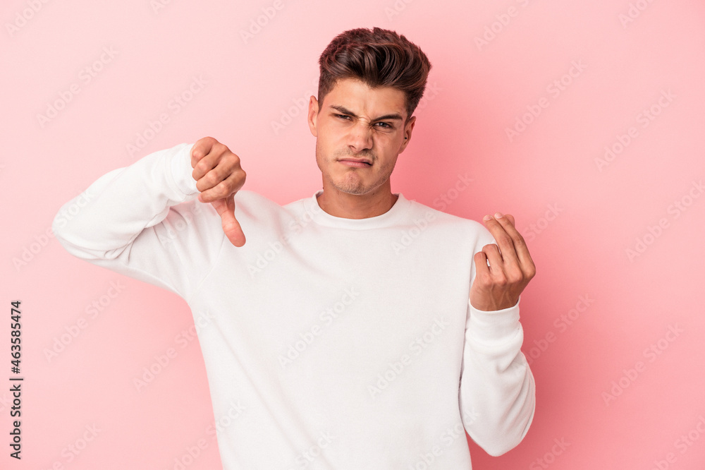 Young caucasian man isolated on pink background showing that she has no money. Young caucasian man isolated on pink background showing that she has no money.
