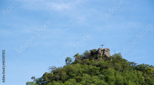 Religious monument on top of natural formation.