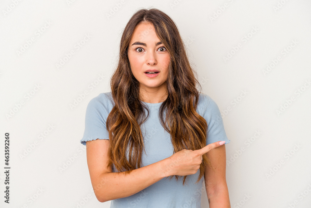 Young caucasian woman isolated on white background pointing to the side Young caucasian woman isolated on white background pointing to the side