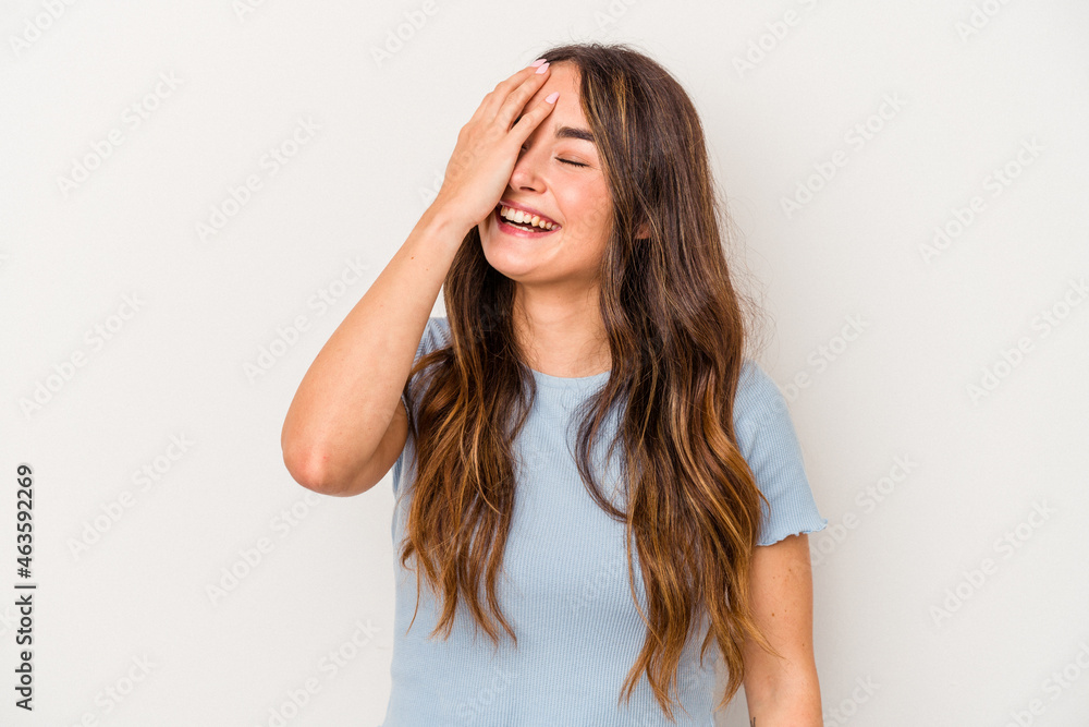 Young caucasian woman isolated on white background laughing happy, carefree, natural emotion. Young caucasian woman isolated on white background laughing happy, carefree, natural emotion.