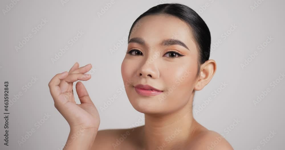 Close up of Beauty Asian woman face looking at camera Close up of Beauty Asian woman face looking at camera
