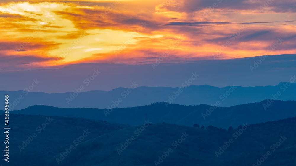 the curved hills seen to the sunset