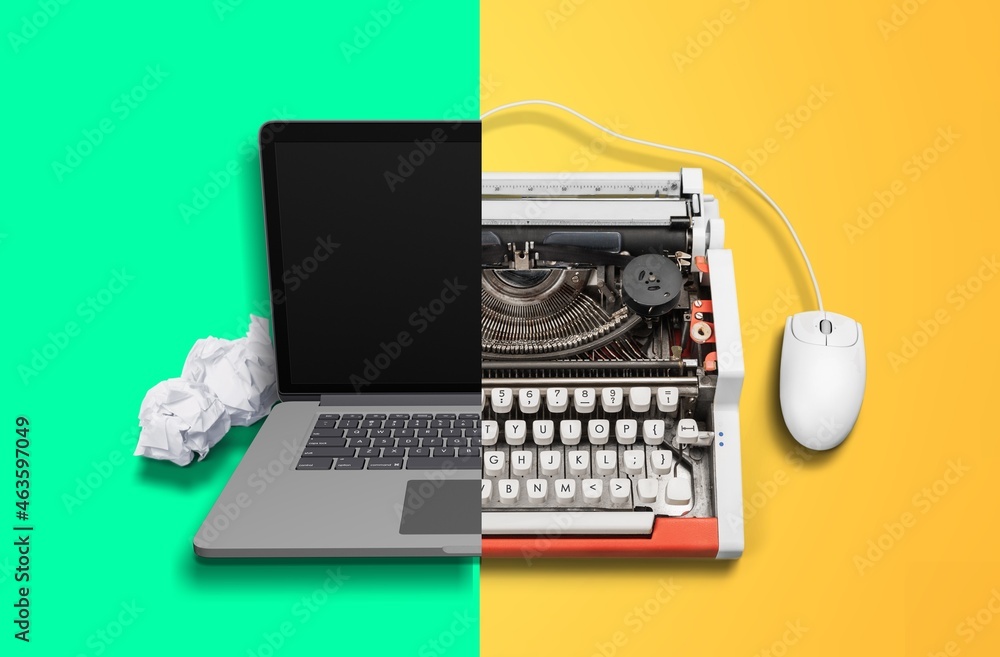 Old vs new technology. Modern computer and typewriter Stock Photo
