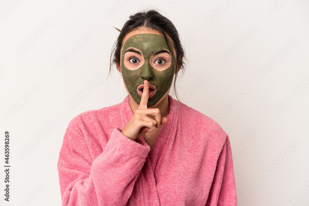 Young caucasian woman wearing a facial mask isolated on white background keeping a secret or asking for silence. Young caucasian woman wearing a facial mask isolated on white background keeping a secret or asking for silence.