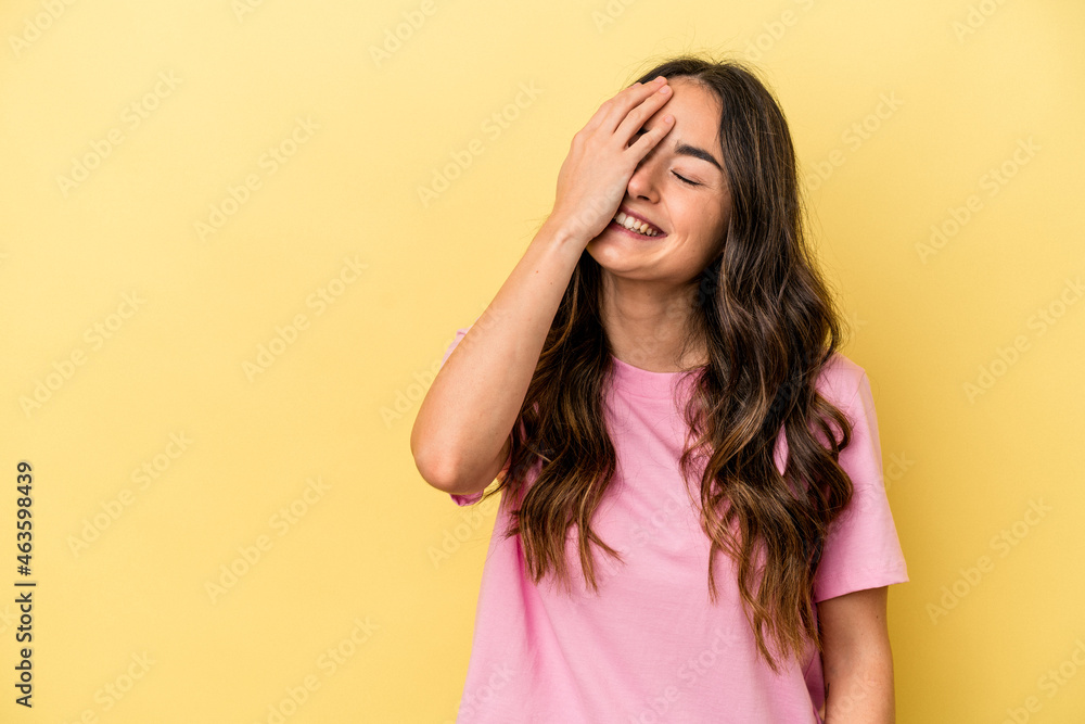 Young caucasian woman isolated on yellow background laughing happy, carefree, natural emotion. Young caucasian woman isolated on yellow background laughing happy, carefree, natural emotion.