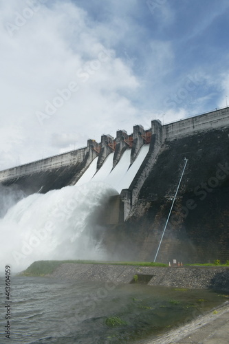 water splashing from floodgate Khun Dan Prakarn Chon huge concrete dam in Thailand photo