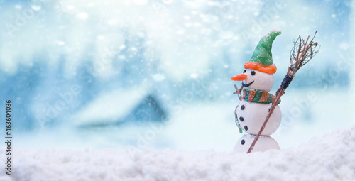 Snowman. Merry christmas and happy new year greeting card.  Snowman In Winter Landscape.  © daphnusia