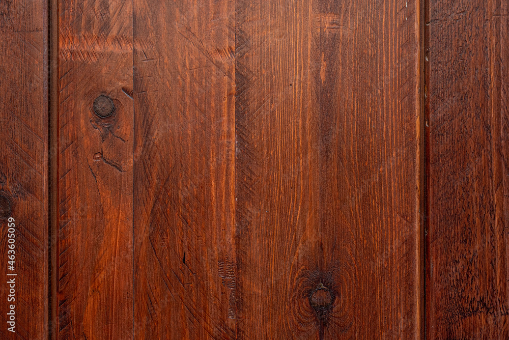 Wooden plank with saw marks and dark knots varnished in a reddish tone. Vector wood texture background Wooden plank with saw marks and dark knots varnished in a reddish tone. Vector wood texture background