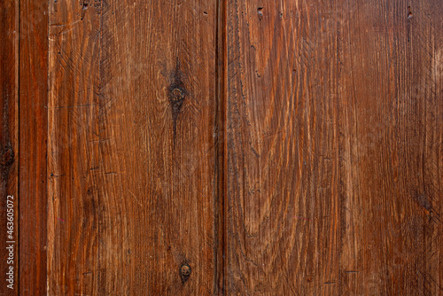 Wood planks with saw marks and dark knots varnished in a dark reddish tone. Vector wood texture background